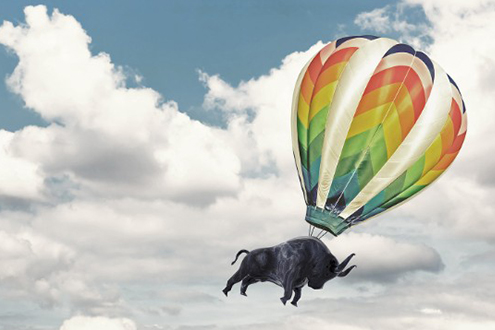 A graphic of a bull rising into the sky on a hot air balloon.